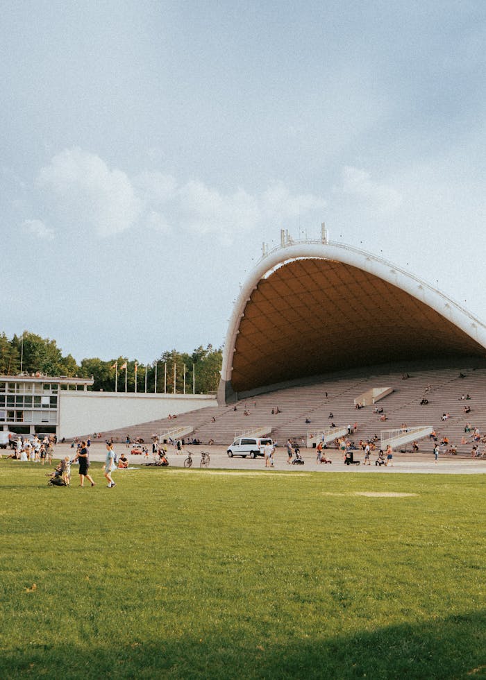 People enjoying a sunny day at the iconic Vingis Park Stadium in Vilnius, Lithuania.